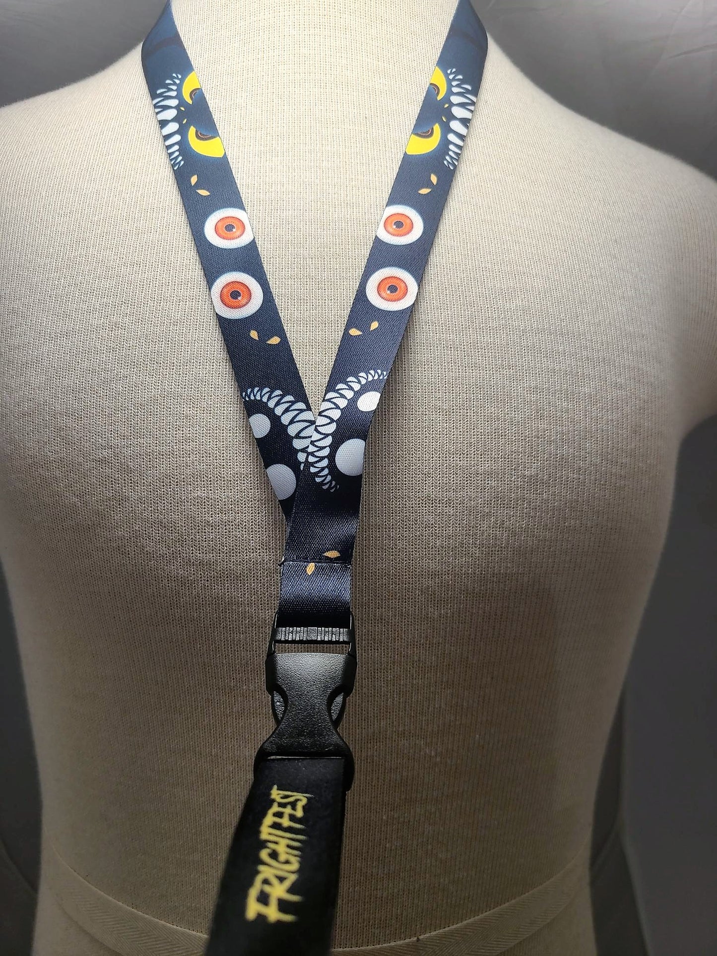 Spooky Eyes Lanyard displayed on model