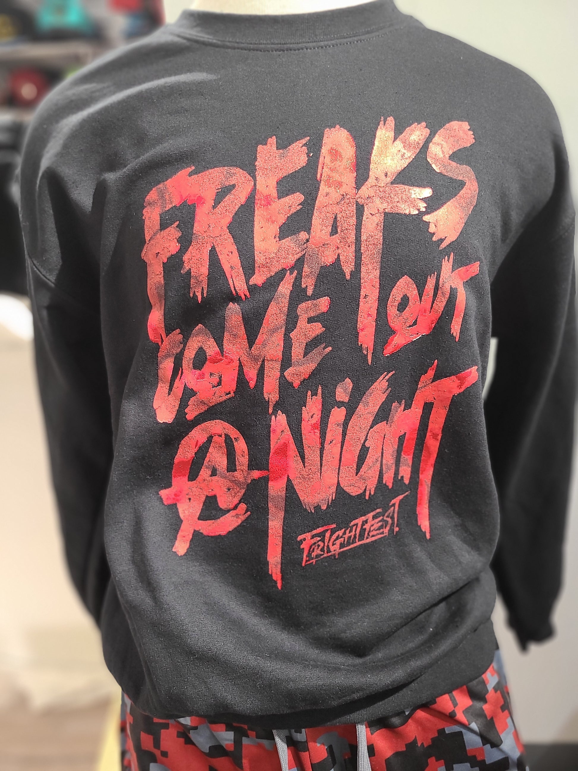 Freaks Come Out Crewneck on display